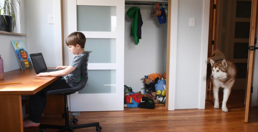 LAKEWOOD, COLORADO - MARCH 17: Seven-year-old Lenox Pineau, a 2nd grader in Jeffco Public Schools, works on doing his first day of online learning in his room at his family’s home on March 17, 2020 in Lakewood, Colorado. Jeffco Public Schools implemented a remote learning and work plan where teachers, students, and staff will educate and learn from home with online programs for an unknown period due to COVID-19.(Photo by RJ Sangosti/The Denver Post)